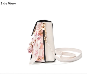 Side view of beige phone bag with pink checkered flap and floral scarf detail