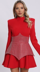 Detail of red long sleeve party dress featuring shimmering silver rhinestone waist decor