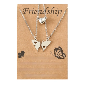 Set of 2 stainless steel butterfly necklaces with magnetic heart charms on gift card