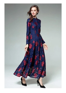 Detail of elegant navy lace maxi dress with red floral embroidery and stand collar