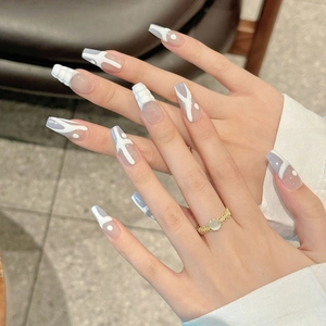 Hand-painted blue and white coffin press-on nails with 3D relief and abstract ink art