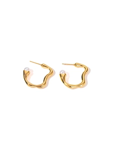 Detailed view of gold lava drop earrings with delicate white pearls on white background