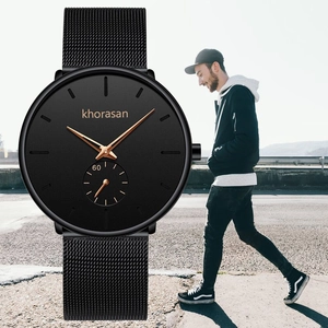 Detail of square business watch with black mesh strap and lifestyle wearing scene