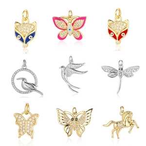 Assorted gold and silver cubic zirconia animal pendants including fox and butterfly