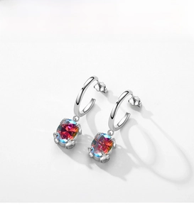 Detail of S925 silver hoop earrings with oval colorful mystic topaz gemstone pendants