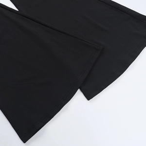 Detailed close-up showing the flare leg hem and fine stitching of black lace jumpsuit