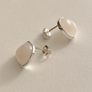 Minimalist 925 sterling silver stud earrings featuring round milky white gemstones