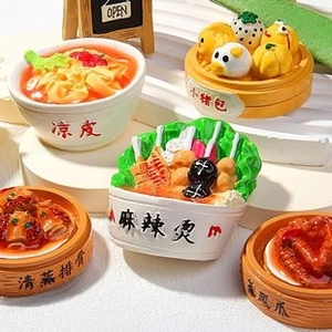 Detailed macro view of miniature resin food magnets showing Chinese cuisine details