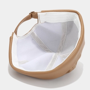 Detailed interior of brown PU leather skull cap showing white fabric lining and fine stitching