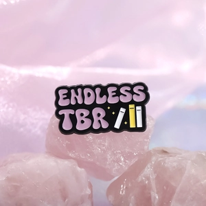 Colorful enamel book pin featuring Endless TBR text on pink crystal stones background
