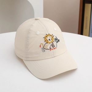 Close-up of beige sun hat with mesh side panels and detailed lion embroidery for kids