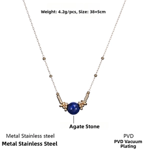 Detail of blue agate bead pendant on a gold PVD plated stainless steel chain necklace