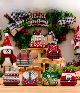 Detail of diverse Christmas tin gift boxes with metal handles and festive patterns