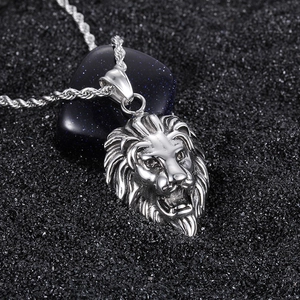 Vintage silver lion head pendant necklace in titanium steel for men with textured backdrop