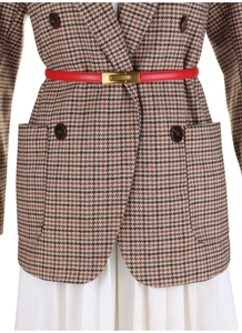 Close-up of red leather skinny belt with gold buckle on brown houndstooth blazer