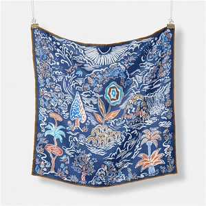 Close-up of luxury silk scarf showing fine twill texture and hand-painted nature landscape