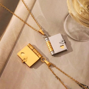 Elegant book-shaped locket necklaces with heart cutout in gold and silver steel finish