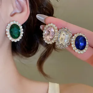 Elegant vintage oval gemstone earrings with sparkling diamond halo in four diverse colors