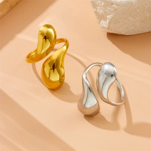 Snake style gold and silver stainless steel open rings with teardrop design on stone base