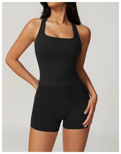 Detail of square neck racerback sports bra and high waist shorts yoga set in black