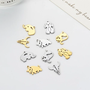 Stainless steel animal pendants in elephant and dog shapes with gold and silver finishes