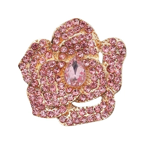 Elegant pink camellia flower brooch with rhinestones on a polished rose gold base