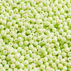 Close-up of 8-12mm luminous cream round beads with pearlescent glow for DIY jewelry making