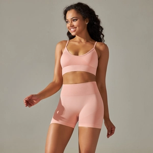 Detail view of the pink seamless knit yoga set showing fine texture and high-stretch fabric