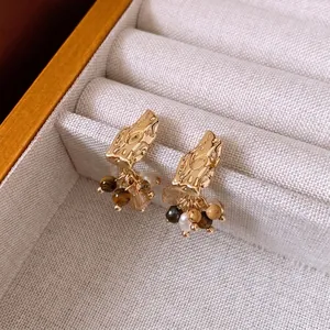 Vintage gold hammered stud earrings with hanging pearl and tiger eye tassels