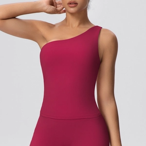 Close-up of deep rose red one-shoulder yoga vest with moisture-wicking matte fabric