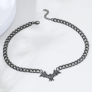 Detail of black bat pendant necklace featuring durable cuban chain and lobster clasp closure