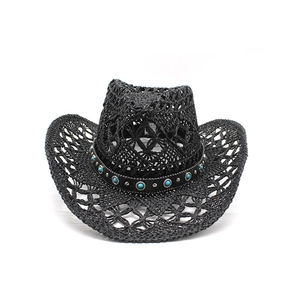 Detail of black straw cowboy hat featuring hollow weave and turquoise stone band decoration