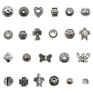 Vintage silver alloy beads in various shapes like hearts and turtles for DIY jewelry