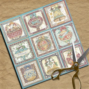 Detail showing vintage Christmas scrapbook paper sheets with festive bell and bauble patterns