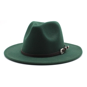 Detail of dark green wool fedora with brown leather strap and vintage silver buckle