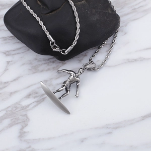 Macro shot of a silver surfer pendant on twisted rope chain over marble background