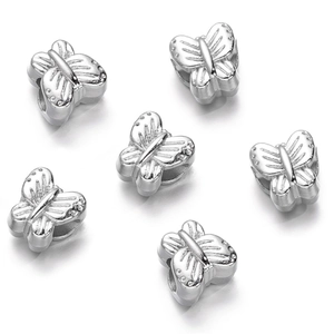 Detailed view of silver butterfly-shaped CCB beads with textured wings for DIY jewelry