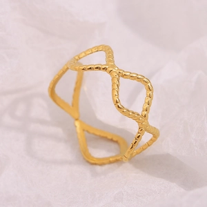 Detailed macro view of 18K gold plated stainless steel ring with woven wavy texture