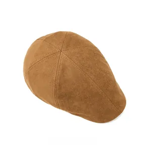 Top view of brown suede beret with classic hexagonal stitching and retro texture