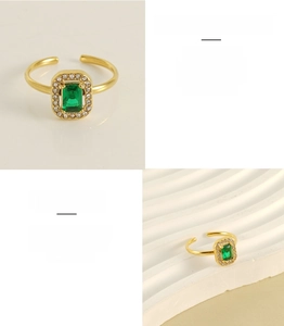Detailed shot of gold plated stainless steel ring featuring green square zircon stone