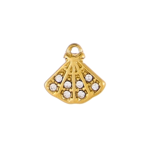 Macro shot of fan-shaped golden pendant with white zircons for jewelry making
