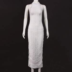 Close-up of ruched texture on a white halter neck bodycon dress with high elastic fabric