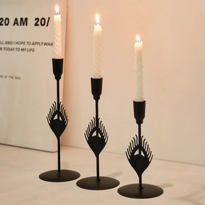 Set of three black peacock feather metal candle holders for romantic dining table decor