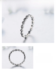 Macro detail showing S925 sterling silver hallmark and sparkling diamond-cut zircon stones