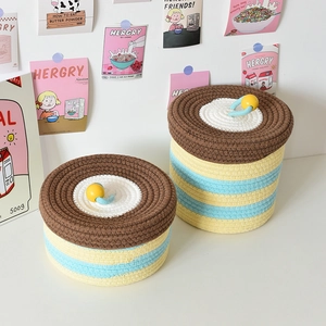 Macro shot of multi-color woven cotton rope storage baskets with lids and handles