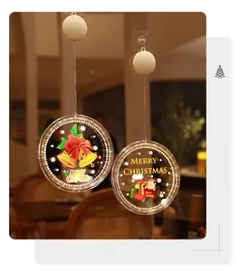Détail de la lampe LED de fenêtre de Noël blanc chaud avec motifs de cloches et Père Noël
