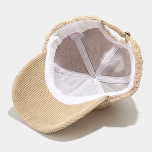 Winter lamb fleece baseball cap with khaki corduroy brim and adjustable strap closure