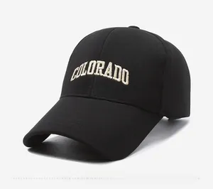 Close-up of black baseball cap featuring white Colorado embroidery and curved brim
