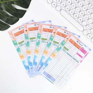 Close-up of budget planner inserts with colorful watercolor design for A6 6-hole binders