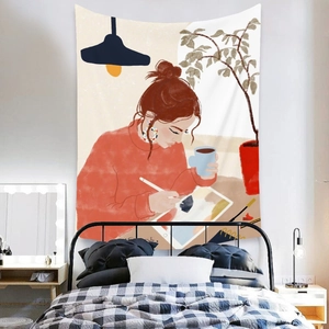 Detail of bohemian wall tapestry featuring an illustration of a woman painting by a lamp
